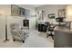 Office space features a comfortable reading chair and a built-in desk with dual monitors at 7138 Mountain Brush Cir, Highlands Ranch, CO 80130