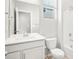Bright, neutral bathroom with white vanity, toilet, and shower/tub combo at 17487 E 89Th Way, Commerce City, CO 80022