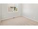 Bright bedroom with neutral carpet, natural light, and clean, bright walls at 17487 E 89Th Way, Commerce City, CO 80022