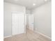 Clean bedroom with neutral carpet and white walls, with a closet at 17487 E 89Th Way, Commerce City, CO 80022