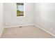 Cozy bedroom with neutral carpet, natural light, and clean, bright walls at 17487 E 89Th Way, Commerce City, CO 80022