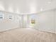 Bright bedroom with three windows overlooking the exterior and neutral carpeting at 17487 E 89Th Way, Commerce City, CO 80022