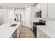 Modern kitchen boasts stainless appliances, granite countertops, and subway tile backsplash at 17487 E 89Th Way, Commerce City, CO 80022