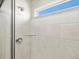 Shower features updated fixtures, window and neutral tiling at 17487 E 89Th Way, Commerce City, CO 80022