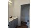 Updated bathroom with modern fixtures, wood-look flooring, and a clean design at 20 E 45Th Ave, Denver, CO 80216