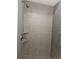 Close-up of a modern shower with a sleek shower head, shelves, and tiled walls at 20 E 45Th Ave, Denver, CO 80216