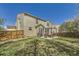 A spacious backyard featuring a patio with a pergola and seating area, perfect for outdoor entertaining at 10168 Granby, Commerce City, CO 80022