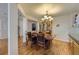 Charming dining room showcasing elegant chandelier and classic wooden table set at 10168 Granby, Commerce City, CO 80022