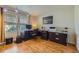Functional home office with large windows, hardwood floors, and ample desk space at 10168 Granby, Commerce City, CO 80022