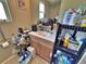 A cluttered single sink bathroom features a wooden vanity and small window at 6060 Locust St, Commerce City, CO 80022