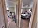 A glimpse into an older-fashioned bedroom showing an open doorway to another room at 6060 Locust St, Commerce City, CO 80022