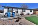 Charming single-story home featuring a ramp to the front door and low-maintenance landscaping at 6060 Locust St, Commerce City, CO 80022