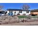 Inviting home with solar panels, a ramp, and fenced yard for privacy and curb appeal at 6060 Locust St, Commerce City, CO 80022