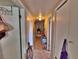 Hallway with neutral carpet, white doors, and an overhead light at 6060 Locust St, Commerce City, CO 80022