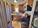 Efficient kitchen features classic wood cabinets, a black appliance suite, and tiled flooring at 6060 Locust St, Commerce City, CO 80022