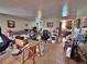Spacious living room featuring carpet flooring and adjoined to another room and the kitchen at 6060 Locust St, Commerce City, CO 80022