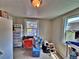 Small room with a window view of a back yard, an orange chair, and a pet station at 6060 Locust St, Commerce City, CO 80022