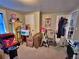 Spare room with furniture, storage containers and a folding chair at 6060 Locust St, Commerce City, CO 80022