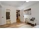 Bedroom view with a decorative bench, a closet and entry to the bathroom at 539 Wright St # 102, Lakewood, CO 80228