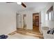 Bedroom featuring wood-look floors, white walls, and multiple doorways to other rooms at 539 Wright St # 102, Lakewood, CO 80228