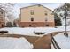 Exterior back view of the building showing the architectural details and surrounding landscaping at 539 Wright St # 102, Lakewood, CO 80228