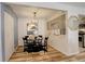 Dining area with contemporary decor, modern light fixture, and seamless flow into the kitchen space at 539 Wright St # 102, Lakewood, CO 80228