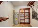 Utility room with water heater and wooden shelving units for storage at 539 Wright St # 102, Lakewood, CO 80228