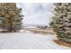 Winter landscape with snow-covered ground and distant mountain views on an overcast day at 539 Wright St # 102, Lakewood, CO 80228