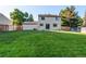 Spacious backyard with lush green lawn, perfect for recreation and outdoor gatherings at 8538 W Glasgow Pl, Littleton, CO 80128