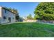 Large backyard space featuring green grass and wooden fence providing privacy at 8538 W Glasgow Pl, Littleton, CO 80128