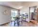 Breakfast nook in a kitchen featuring a glass table and view to the backyard at 8538 W Glasgow Pl, Littleton, CO 80128