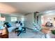 Open-concept living room featuring neutral walls and staircase to the upper level at 8538 W Glasgow Pl, Littleton, CO 80128