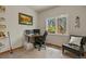 Bedroom featuring a desk, reading chair, and window with views of the surrounding forest at 929 Tenderfoot Dr, Larkspur, CO 80118