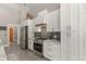 Bright kitchen features stainless steel appliances, subway tile backsplash, and ample cabinet space at 929 Tenderfoot Dr, Larkspur, CO 80118