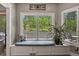 Cozy window seat provides natural light and views of the outdoor landscape at 929 Tenderfoot Dr, Larkspur, CO 80118