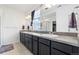 A modern bathroom with double sinks, and plenty of cabinet space at 18060 E 106Th Pl, Commerce City, CO 80022