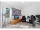 This bedroom features a TV on a dresser and a desk at 18060 E 106Th Pl, Commerce City, CO 80022