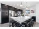 Modern kitchen boasts stainless steel appliances, granite countertops, and an island with seating at 18060 E 106Th Pl, Commerce City, CO 80022