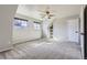 Bright bedroom featuring two windows, neutral paint, and a built-in shelving nook at 10425 Red Mountain West, Littleton, CO 80127