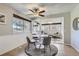 Charming breakfast nook with modern lighting and adjacent sunroom with bright, natural light at 10425 Red Mountain West, Littleton, CO 80127