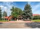 The Ranch House, Ken Caryl Office, a charming building with American flags displayed at 10425 Red Mountain West, Littleton, CO 80127