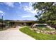 Ken-Caryl Ranch Community Center entrance with lush landscaping and a welcoming walkway at 10425 Red Mountain West, Littleton, CO 80127