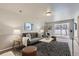 Inviting living room with neutral walls, area rug, and sliding doors to the outside at 10425 Red Mountain West, Littleton, CO 80127