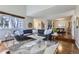 Stylish living room showcasing an open floor plan with hardwood floors and modern decor at 10425 Red Mountain West, Littleton, CO 80127