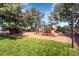 Outdoor community playground with slides, ladders and lush grass is the perfect place for to have fun at 10425 Red Mountain West, Littleton, CO 80127