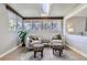 Cozy sunroom featuring lots of natural light, seating area, and tile floors at 10425 Red Mountain West, Littleton, CO 80127