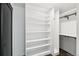 Walk-in closet with built-in shelving and storage, ideal for organization and maximizing space at 7123 S Hudson Cir, Centennial, CO 80122