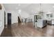 Open living room and kitchen featuring hardwood floors and modern design at 7123 S Hudson Cir, Centennial, CO 80122