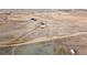 Aerial view of property showing house, shop, and surrounding land at 38911 E Wesley Ave, Bennett, CO 80102