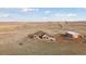 Aerial view of house, detached shop, and surrounding land at 38911 E Wesley Ave, Bennett, CO 80102